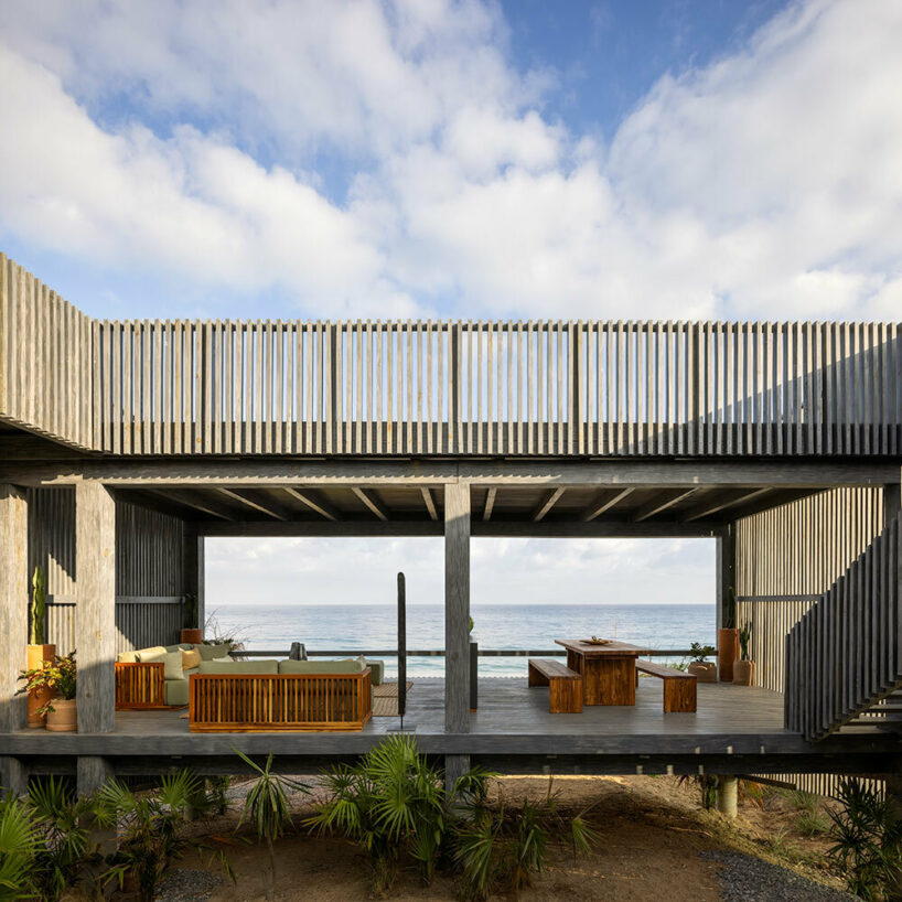 UAVI pavilion by PPAA is an ephemeral wooden haven rising above mexico's sandy shores