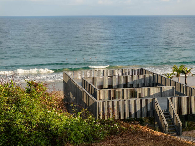 UAVI pavilion by PPAA is an ephemeral wooden haven rising above mexico's sandy shores