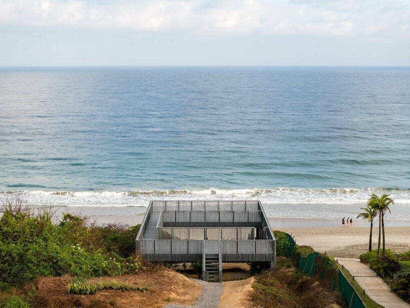 UAVI pavilion by PPAA is an ephemeral wooden haven rising above mexico's sandy shores