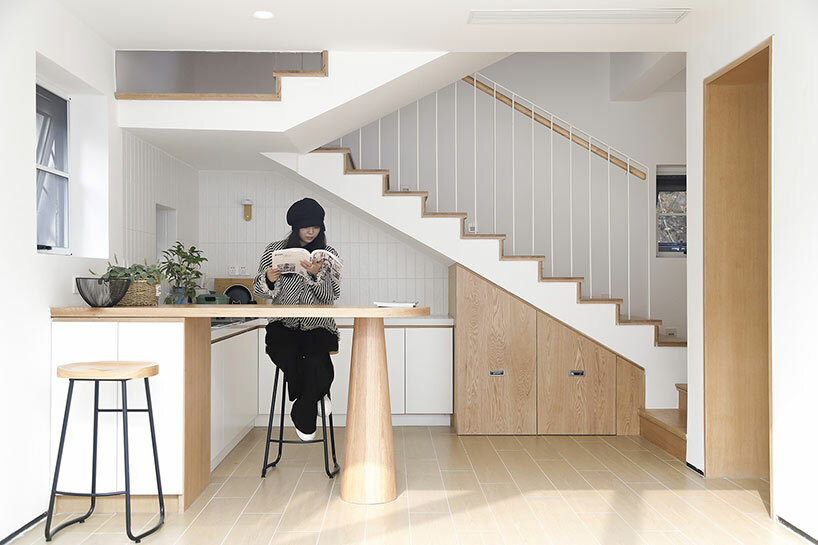 brick & cube architects' youli hotel glows within a mountain village outside beijing