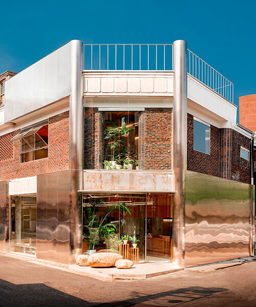 brick, concrete and stainless steel compose layered facade of renovated café in korea