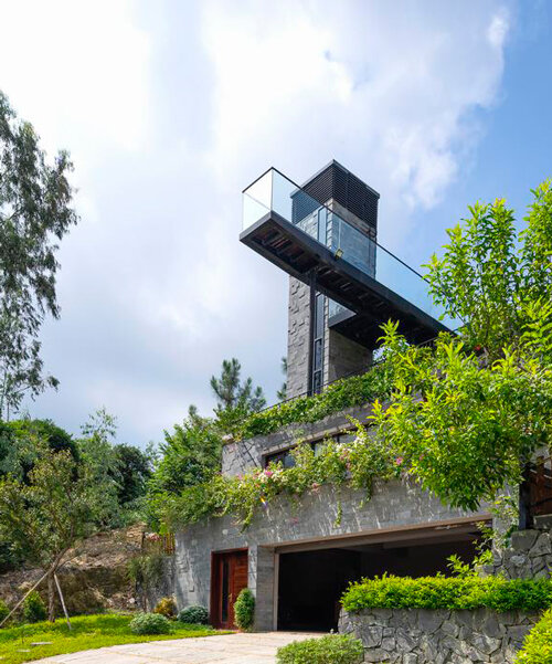 steel frame supports stone-clad ajisai hill house's volumes unfolding in vietnam
