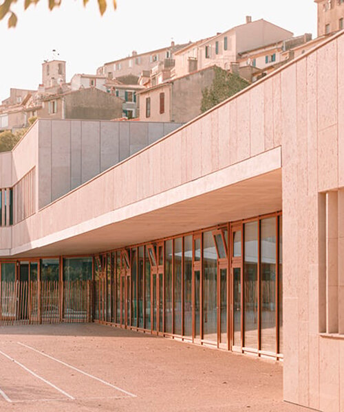 amelia tavella embeds tiered educational institution within valley's natural contours in france