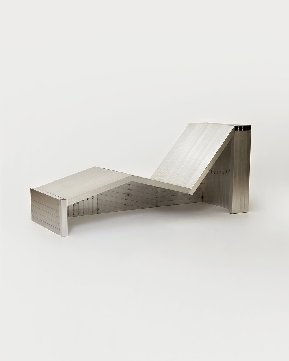 studio HAOS combines zinc sheets and aluminum tubes to craft antimatière furniture series