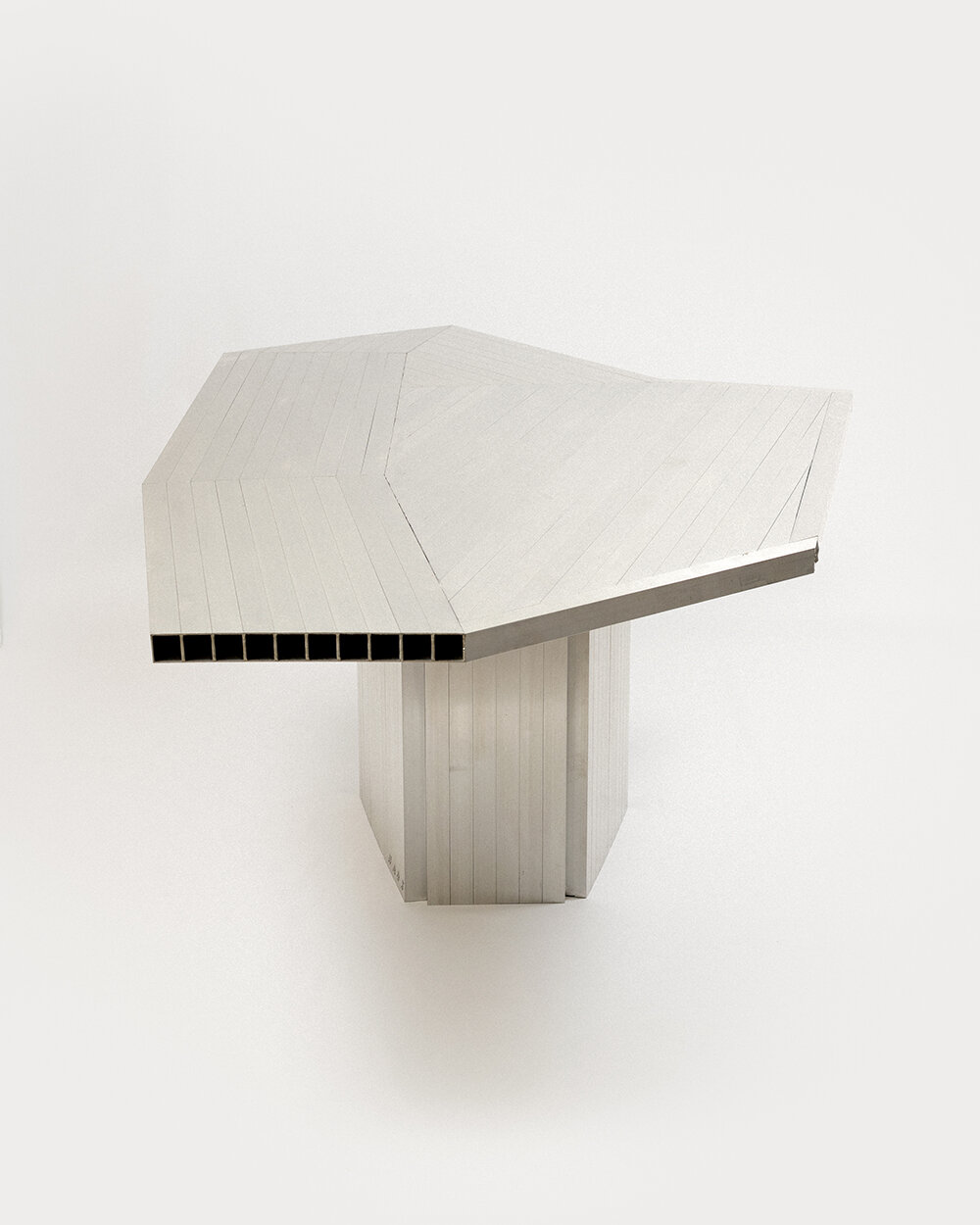 studio HAOS combines zinc sheets and aluminum tubes to craft antimatière furniture series