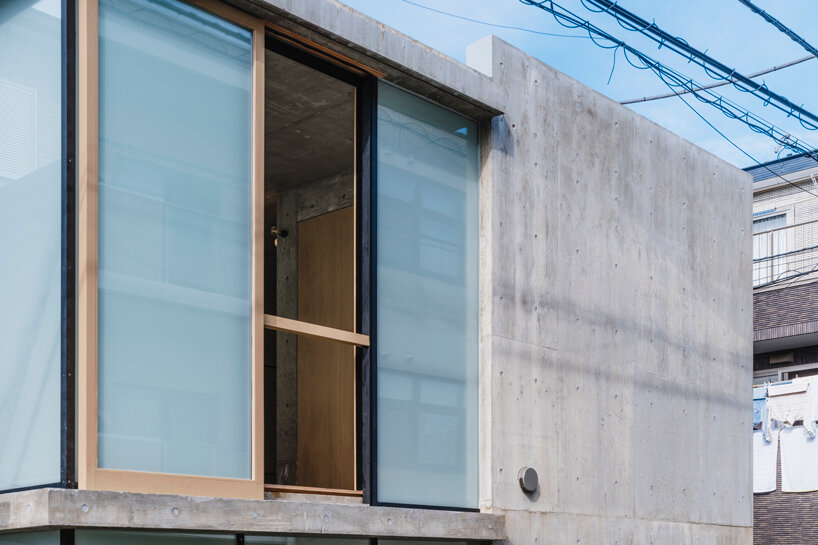 IGArchitects explores interconnectedness and privacy within concrete house in japan