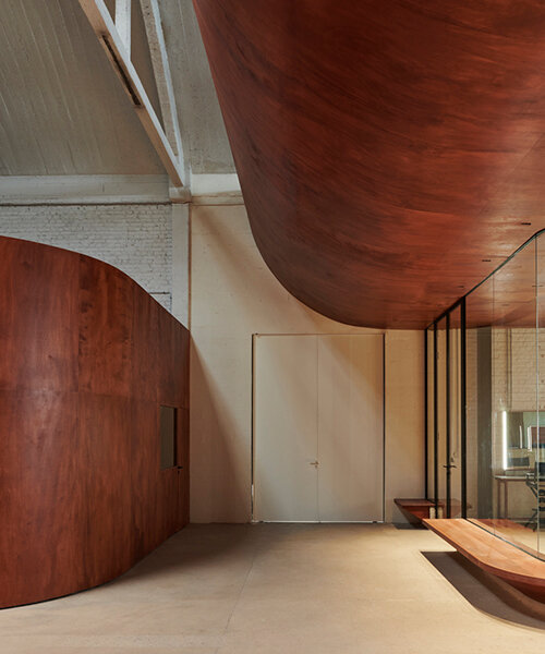 delordinaire imbues redwood curves & raw earth bricks into rouchon paris production studio