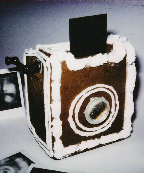edible film camera covered with gingerbread cookies can snap and print instax square photos