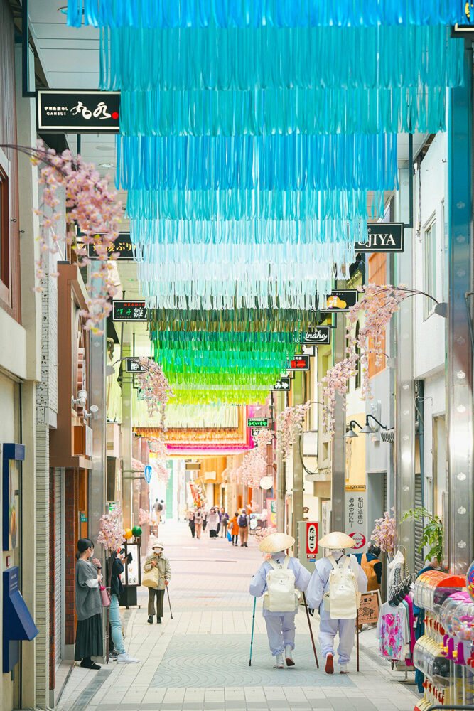 emmanuelle moureaux hangs 100 washi tape shades over dogo shopping street