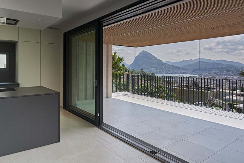 enrico sassi architetto sites 'villa lugano pregassona' over alpine lake in switzerland
