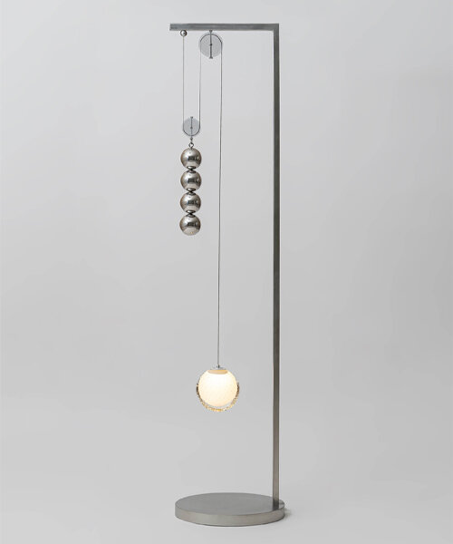 with a pulley system, jaewoo ahn suspends blown glass & pendulums in a state of equilibrium