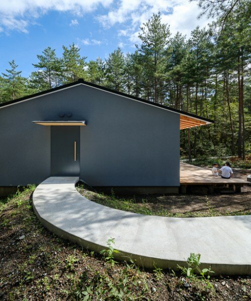 a light and nature infused corridor punctuates YSLA architects' idyllic forest retreat in japan