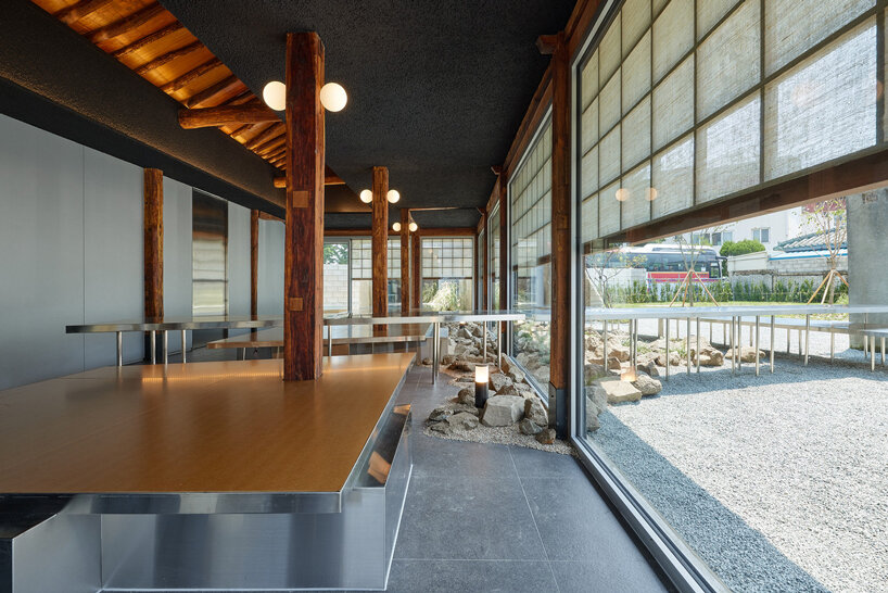 traditional wooden hanok roof frame tops nomal's renovated restaurant in korea