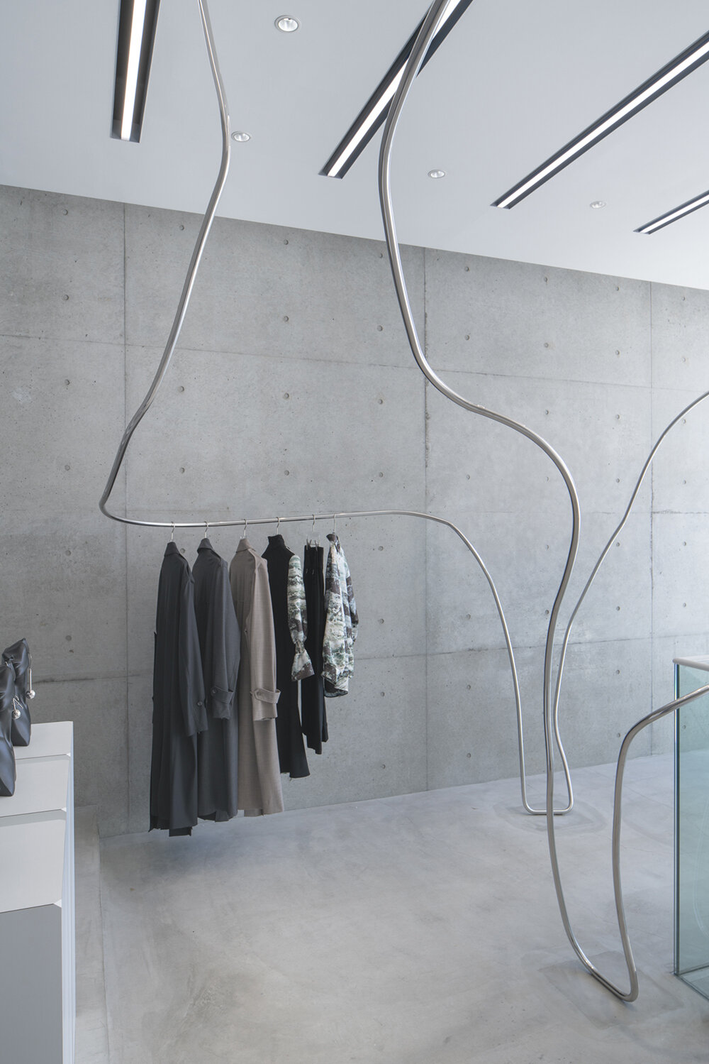 stainless steel tubes curve and flow across the mikage shin aoyama store in tokyo