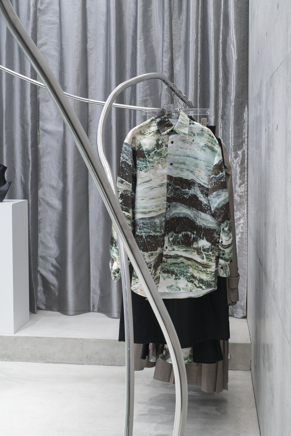 stainless steel tubes curve and flow across the mikage shin aoyama store in tokyo