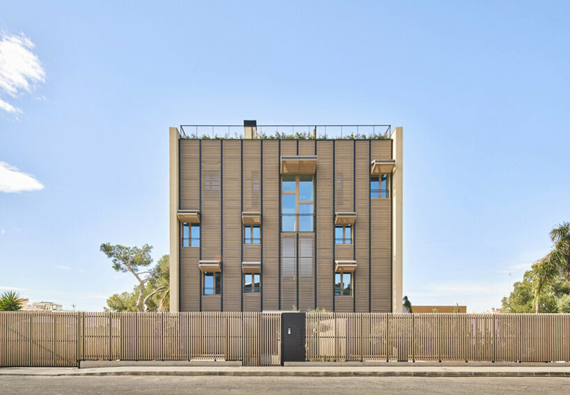 dynamic OHLAB facade switches from shutters to pergolas across paral·lel complex in spain