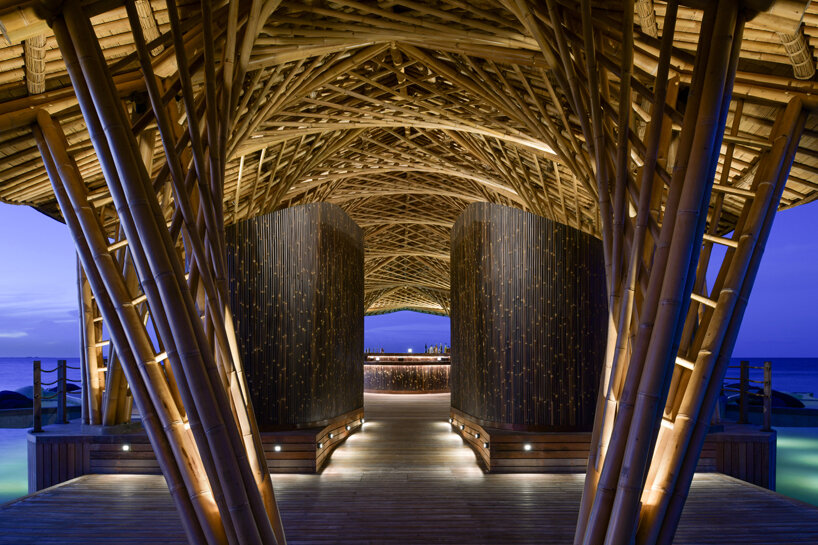atelier nomadic's overwater bamboo restaurant emerges like a sea creature in the maldives