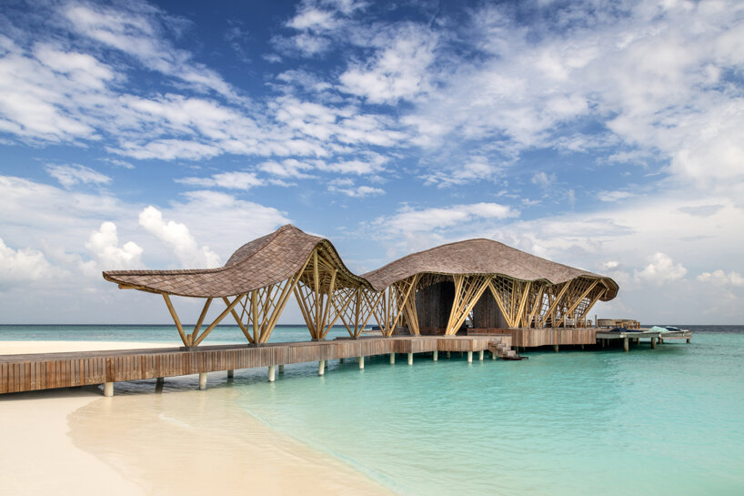 atelier nomadic's overwater bamboo restaurant emerges like a sea creature in the maldives