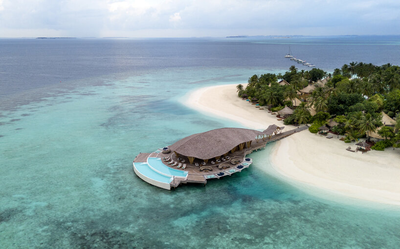 atelier nomadic's overwater bamboo restaurant emerges like a sea creature in the maldives