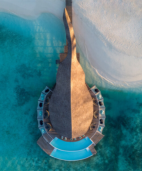 atelier nomadic's overwater bamboo restaurant emerges like a sea creature in the maldives