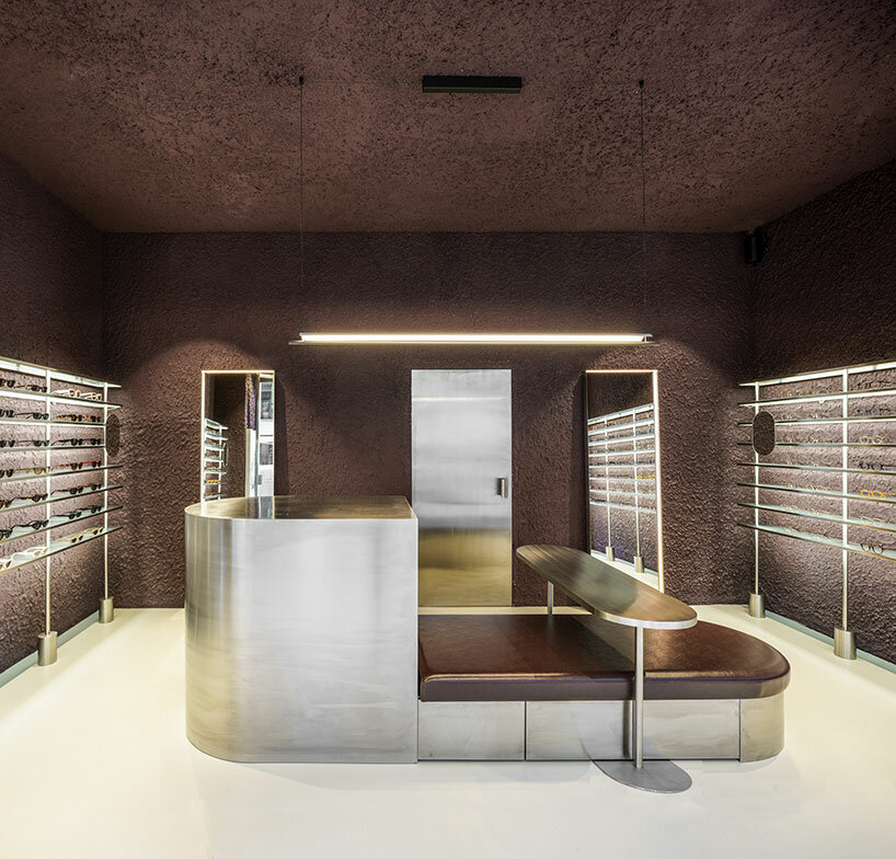 el departamento infuses mountainous hues into texturized optical boutique in madrid