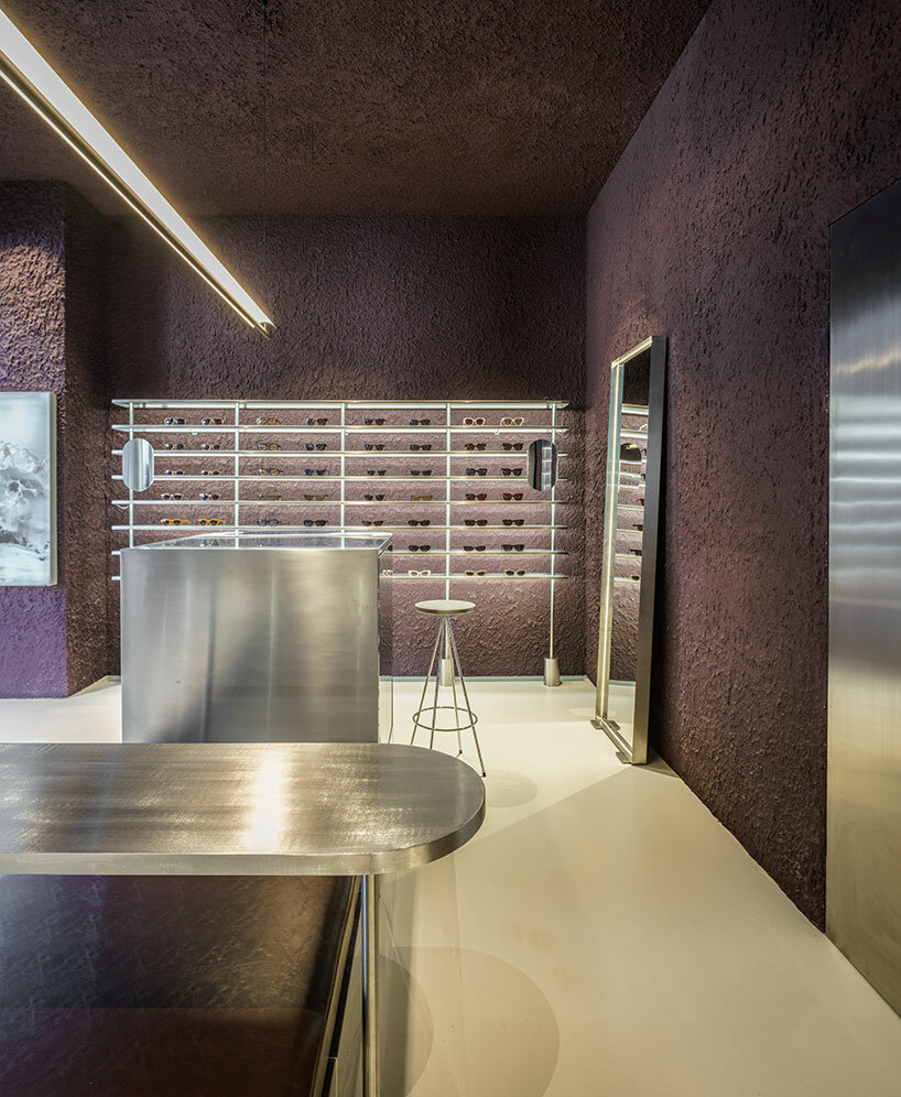 el departamento infuses mountainous hues into texturized optical boutique in madrid