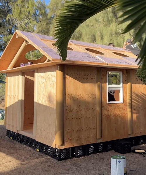 shigeru ban's paper log house prototype lands in maui for wildfire relief
