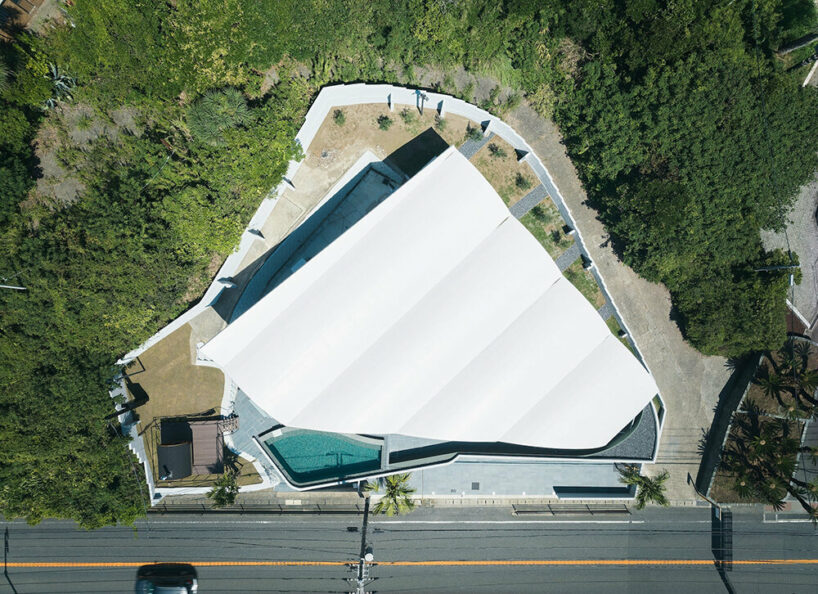 teamSTAR crowns villa A with a vaulted roof echoing japan's rolling ocean waves