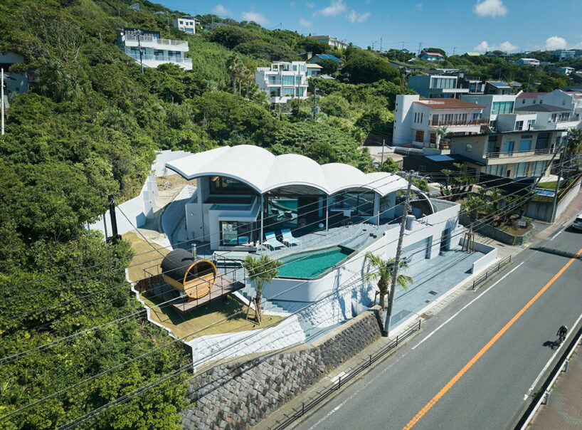 teamSTAR crowns villa A with a vaulted roof echoing japan's rolling ocean waves