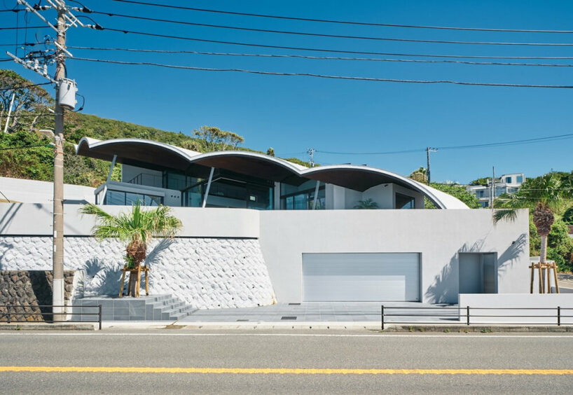 teamSTAR crowns villa A with a vaulted roof echoing japan's rolling ocean waves