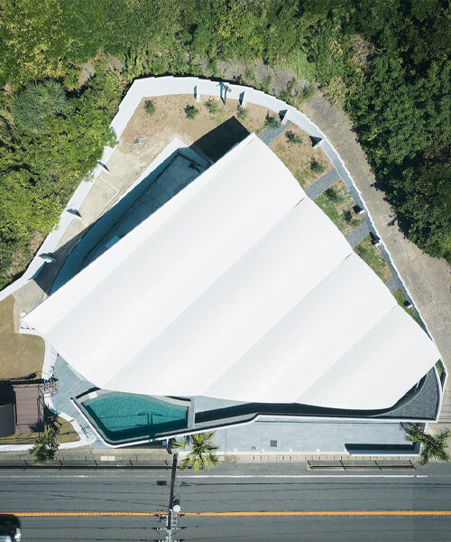 teamSTAR crowns villa A with a vaulted roof echoing japan's rolling ocean waves