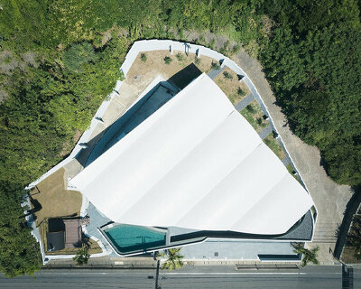 teamSTAR crowns villa A with a vaulted roof echoing japan's rolling ocean waves