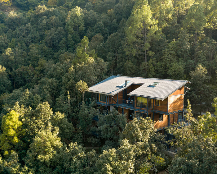 timber villa in the woods by studio lotus floats among himalayan forest