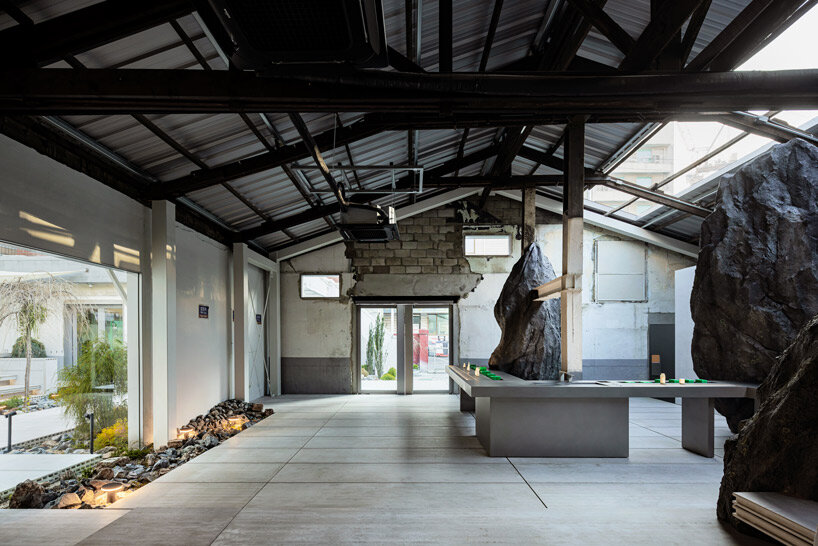 WGNB's beauty store in seoul recreates imaginary island landscape with giant rocks 