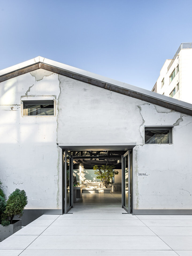 WGNB's beauty store in seoul recreates imaginary island landscape with giant rocks 