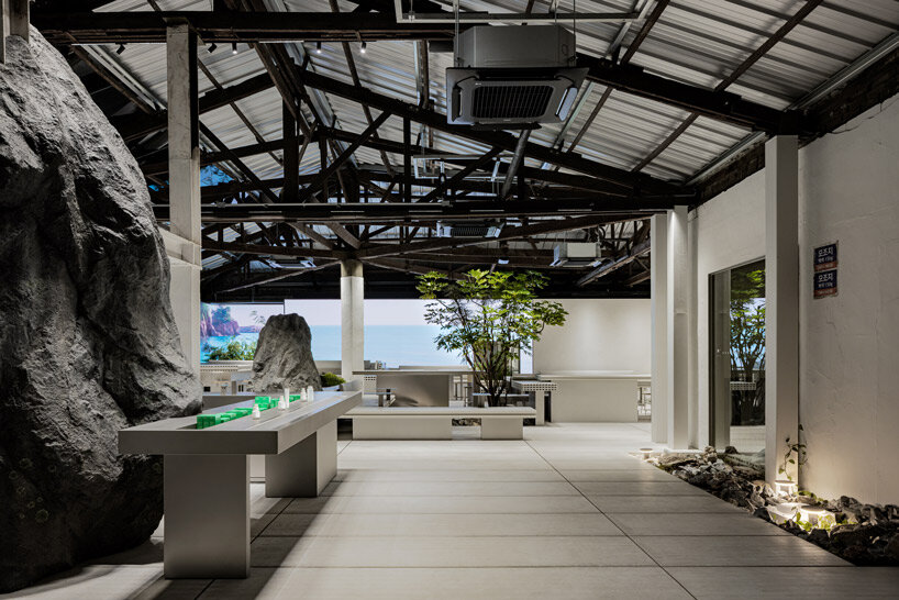 WGNB's beauty store in seoul recreates imaginary island landscape with giant rocks 