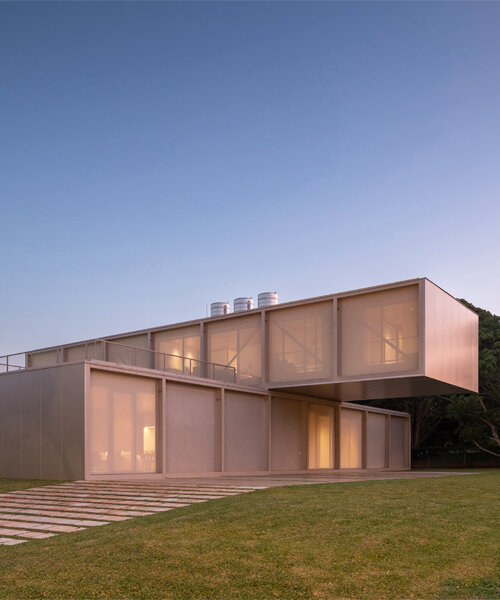 bloco arquitetos' 350 house unfolds as translucent, crosswise volumes in brazil