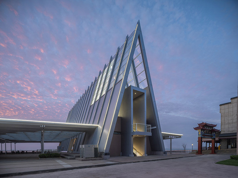 UAO design's liangzi island pier is punctuated by a glowing A-frame 'lighthouse'
