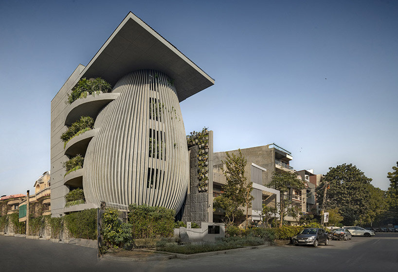 atrey design studio's tilted workspace in india resembles swaying trees