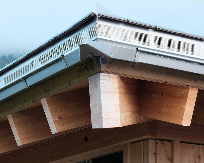 swiss architect charly jolliet tops this minimalist alpine house with a pyramid roof