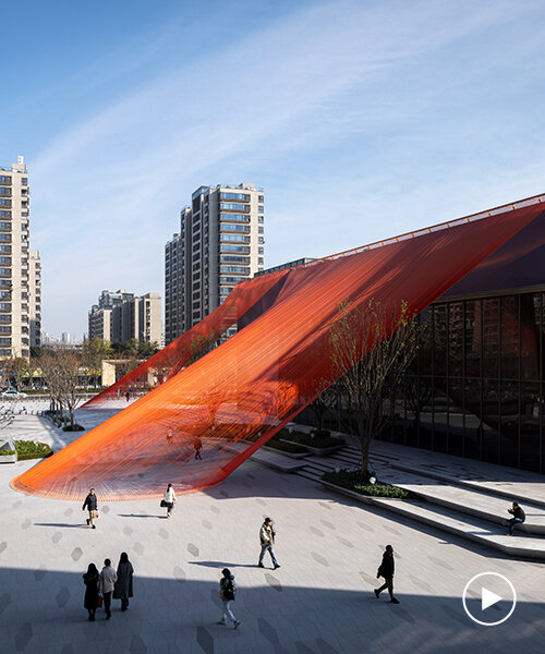 behin ha weaves temporary installation with orange fabric ribbons at hangzhou complex