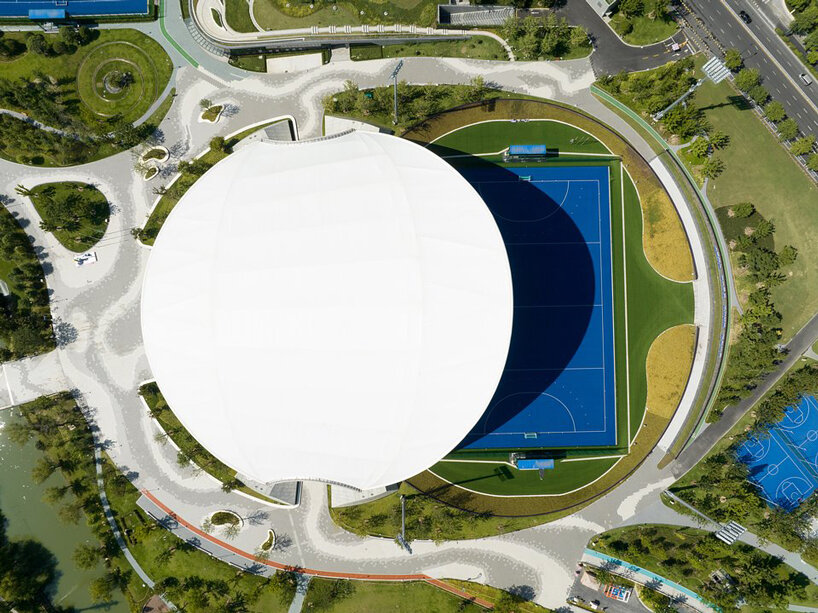 archi-tectonics tops field hockey stadium in hangzhou with 125-meter free-span wing roof