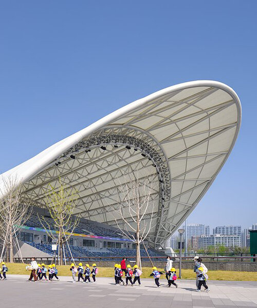 archi-tectonics tops field hockey stadium in hangzhou with 125-meter free-span wing roof