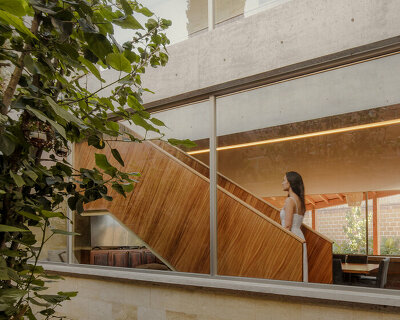 shielded portico encircles residence's square volumes in mexico