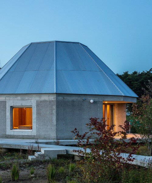 curious concrete dwellings by aoa architects seemingly hover above korean countryside