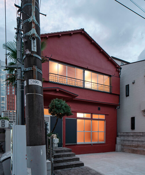renovated wooden house boasts bright red facade in central tokyo