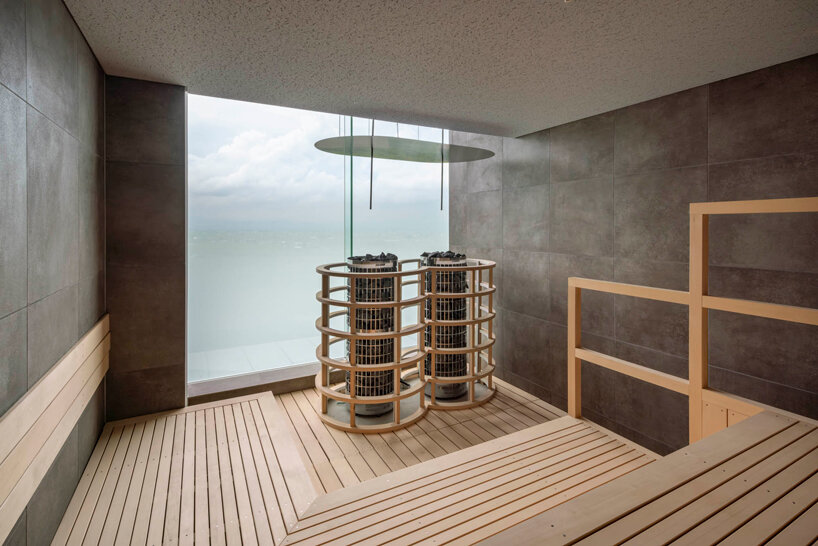 kengo kuma cloaks hot spring resort in hokkaido with locally sourced larch wood