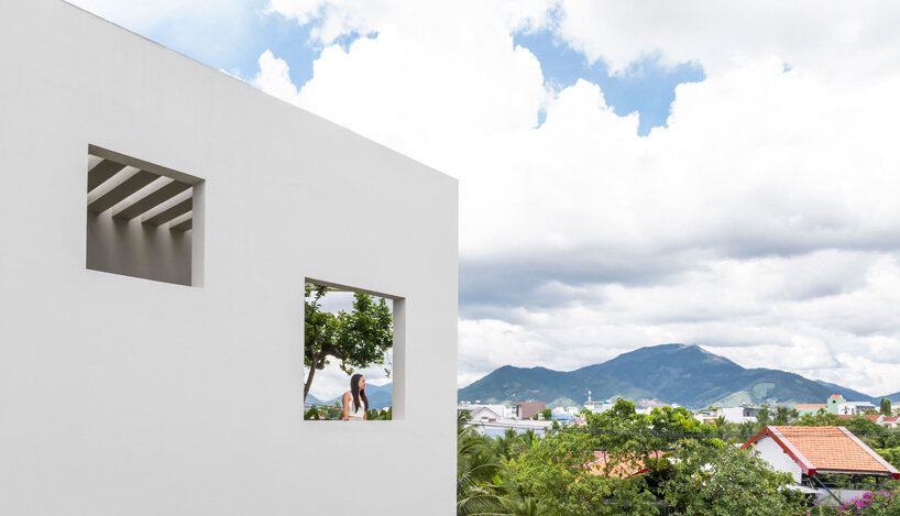 cut-out patios bring nature inside pham huu son's skygarden house in vietnam
