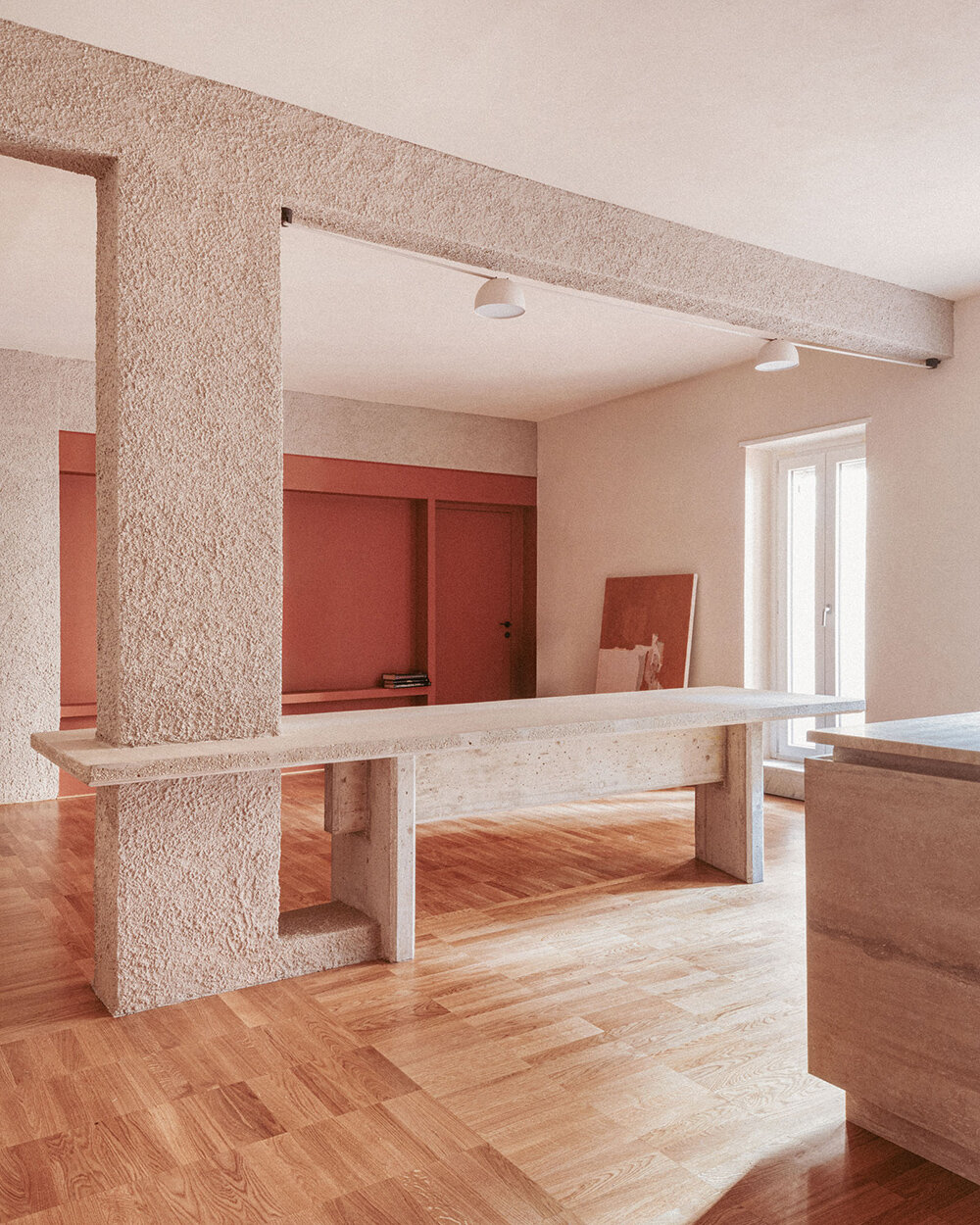 exposed column takes center stage inside studio traccia's renovated 1970s flat in rome