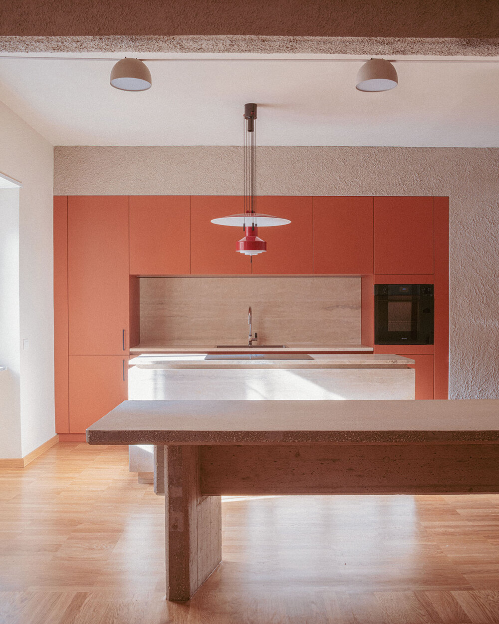 exposed column takes center stage inside studio traccia's renovated 1970s flat in rome